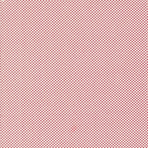 a red and white background with small dots