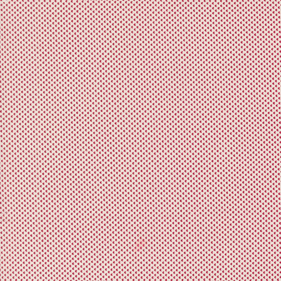 a red and white background with small dots